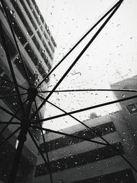Close-up of wet glass window in rainy season