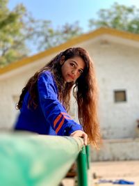 Portrait of young woman with long hair