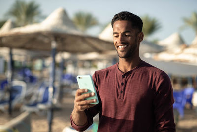 Young man using mobile phone