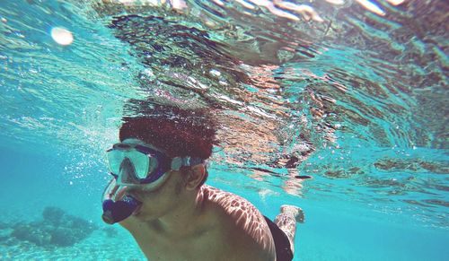 High angle view of man swimming in water