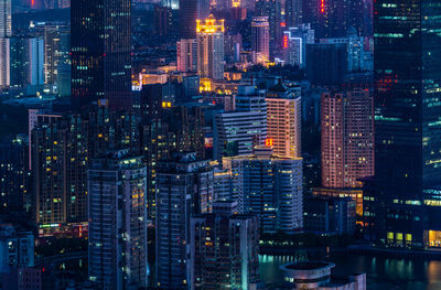 Aerial view of illuminated buildings in city at night