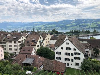 Houses in town against sky