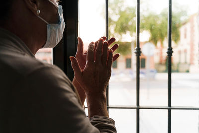 Rear view of man on glass window