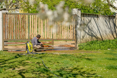 Side view of man sitting on seat