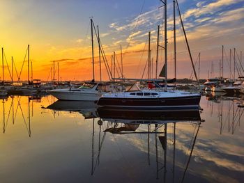 Boats moored at harbor