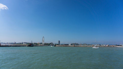 Sea with buildings in background