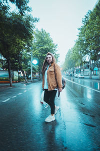 Full length portrait of man walking in city