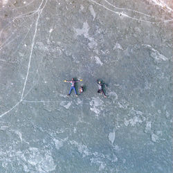 High angle view of men on rock