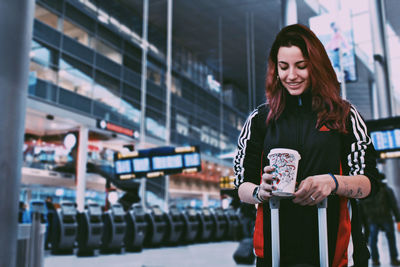 Woman standing against the wall