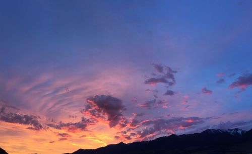 Low angle view of dramatic sky during sunset