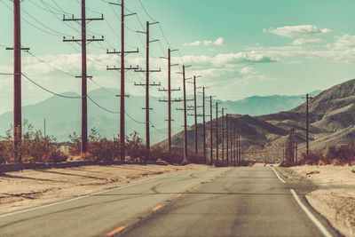 Empty road against sky