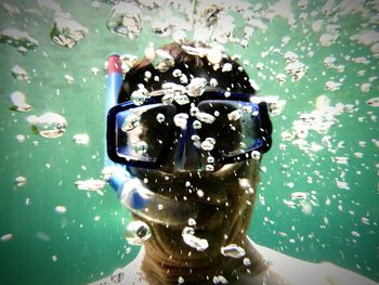 Close-up of person swimming in sea