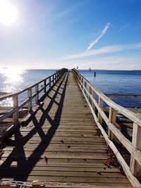 Pier over sea against sky