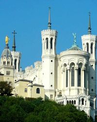 Low angle view of church against blue sky