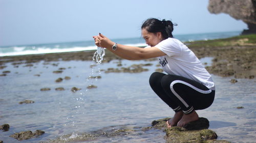 Full length of woman on beach