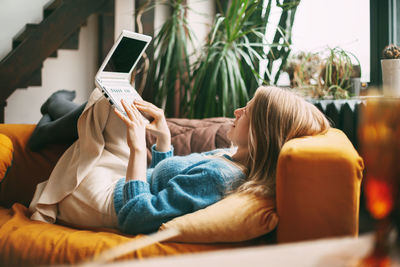 Midsection of man using mobile phone