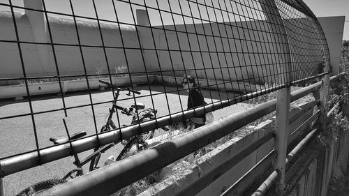 Group of people on metal fence