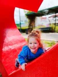 Portrait of cute girl sitting in tent
