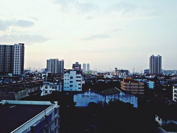 High angle view of buildings in city against sky