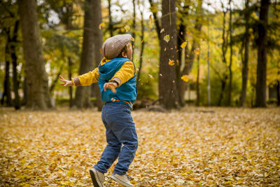 Side view of a boy in forest