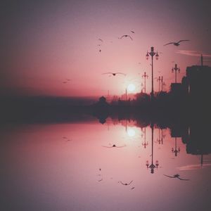 Reflection of clouds in water at sunset