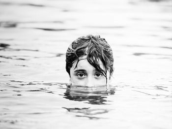 Portrait of man swimming in pool