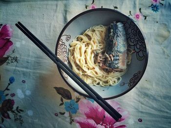 Close-up high angle view of noodles with fish in bowl