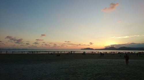 Scenic view of beach against sky during sunset