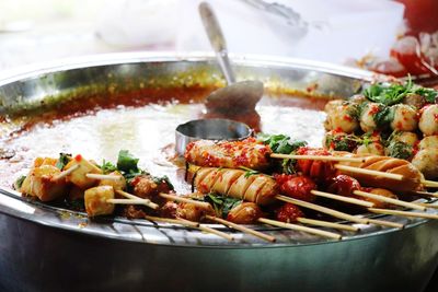 Close-up of meat in cooking pan on table