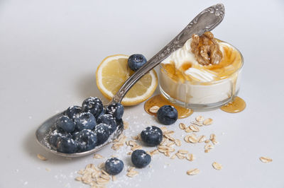 High angle view of breakfast on table against white background