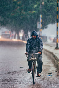 Man riding bicycle on street