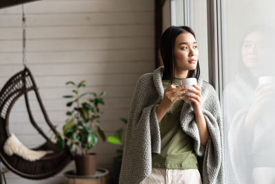 Young woman using mobile phone