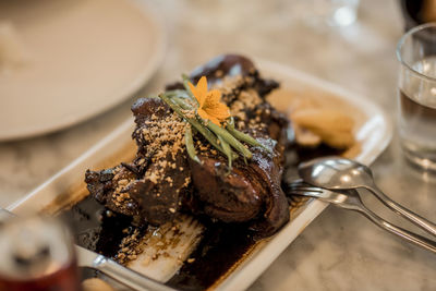 Close-up of meat in plate on table