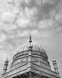 Low angle view of church against cloudy sky