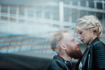 Side view of young couple outdoors