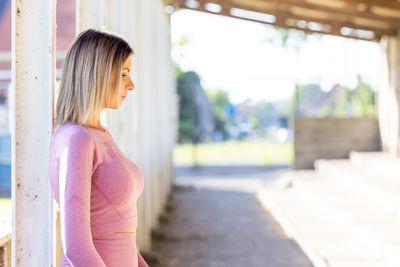 Side view of young woman looking away