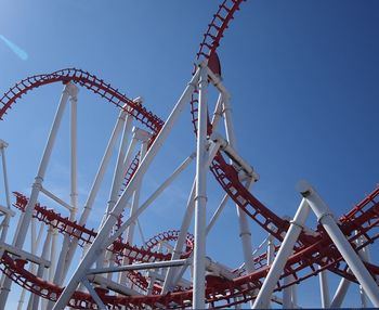 Low angle view of ferris wheel against clear sky