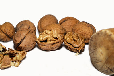 Close-up of pastries against white background