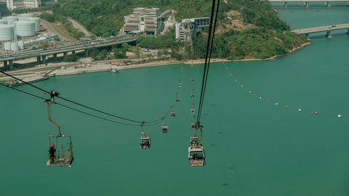 High angle view of overhead cable cars over sea