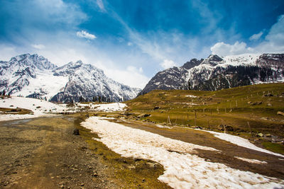 View of snow covered mountain against cloudy sky