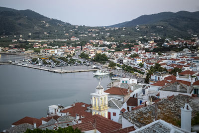 Top view at the skopelos port chora and hills of the skopelos island, greece in summer time.