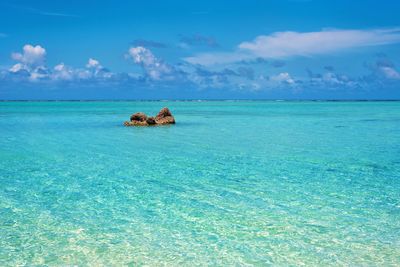 Scenic view of sea against blue sky