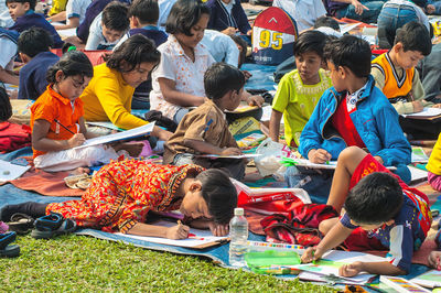 Group of people sitting outdoors