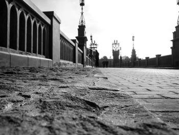 Close-up of water in city against sky