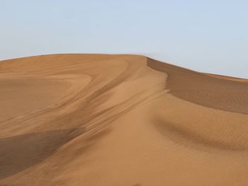 Scenic view of desert against clear sky