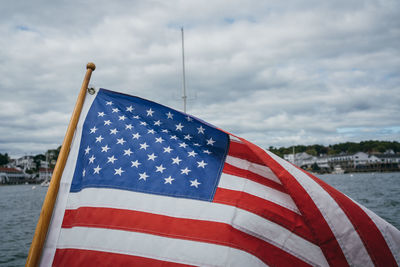 Low angle view of flag against sky