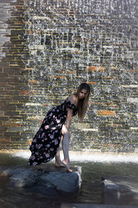 Side view of woman on wall