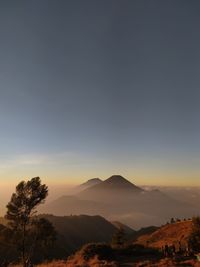 Scenic view of landscape against sky during sunset