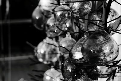Close-up of christmas decorations hanging on metal