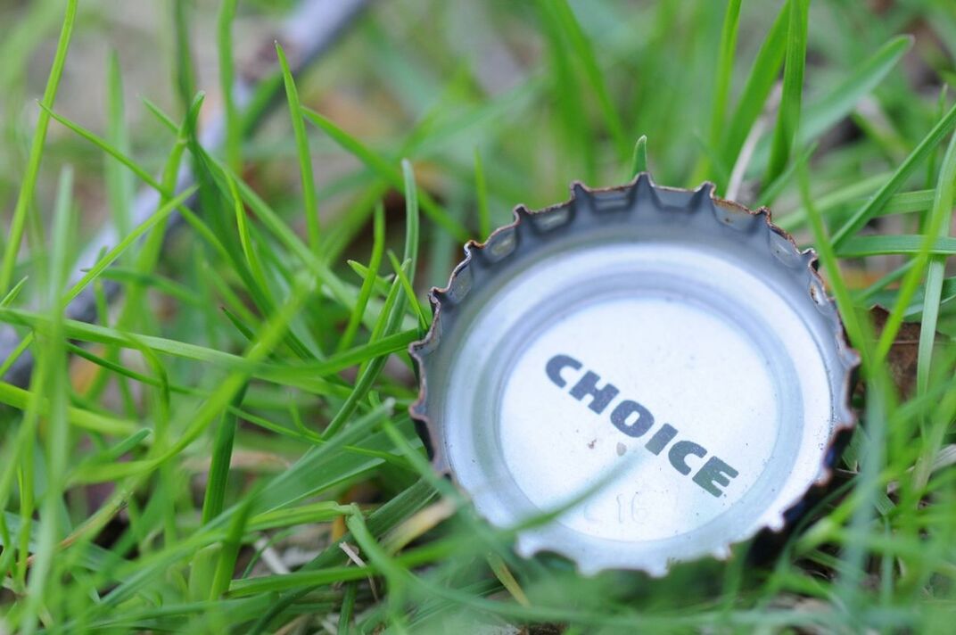 grass, close-up, communication, green color, text, number, focus on foreground, field, western script, no people, selective focus, technology, grassy, day, circle, metal, plant, outdoors, guidance, single object